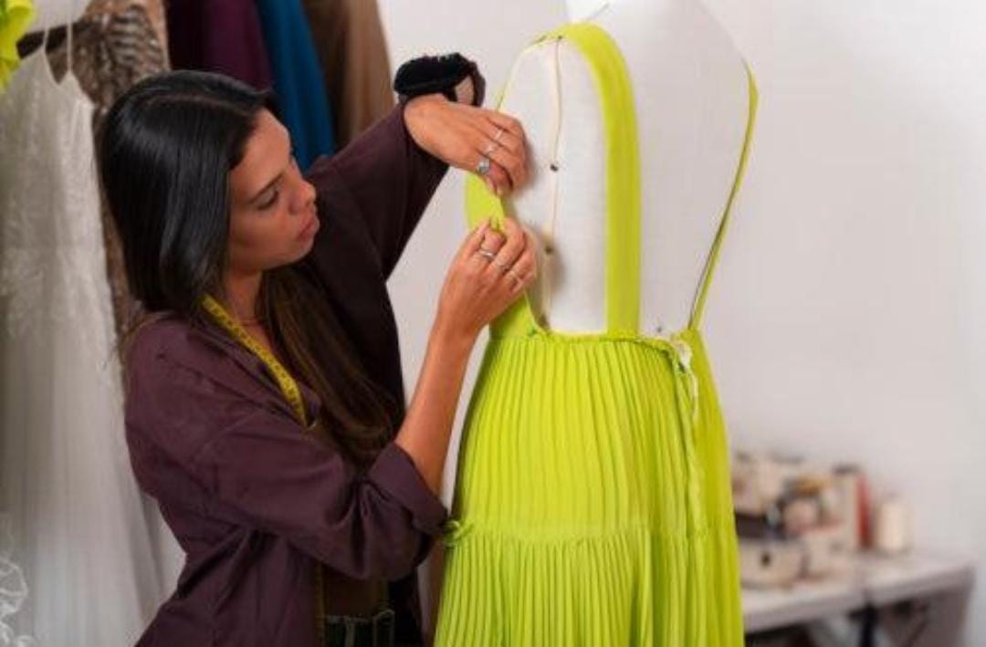 Gown being fitted on mannequin
